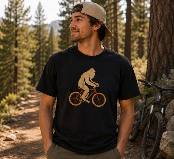 Bigfoot Cycling Comfort Colors • Sasquatch Riding Bike Tee • Funny Cryptid T-Shirt • Retro Outdoors Graphic