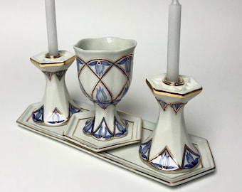 Porcelain Shabbat set: a pair of candlesticks, and a Kiddush cup on a tray.