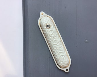 White porcelain Mezuzah case with sticky tape