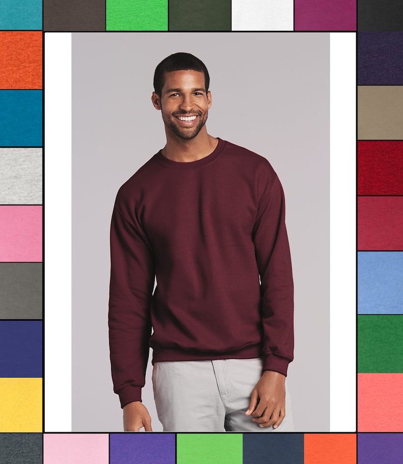 May include: A maroon crew neck sweatshirt with long sleeves.