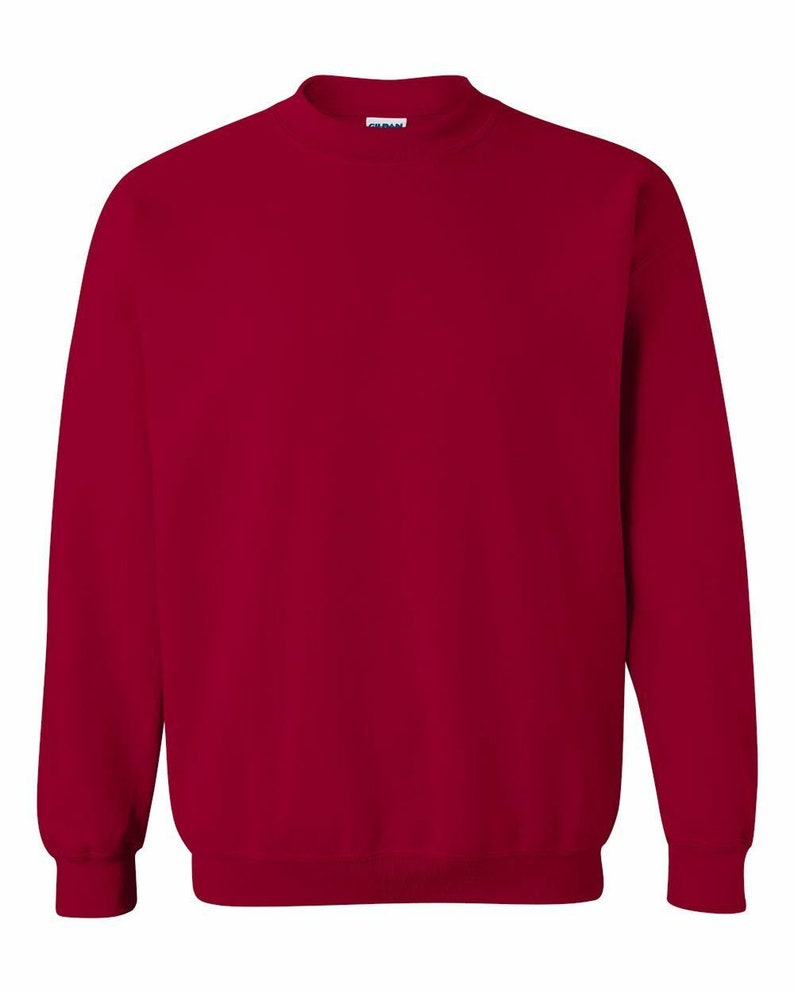 May include: A solid red crew neck sweatshirt.