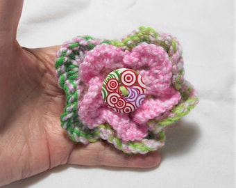 Hand knitted flower brooch / Corsage, Pink + Green, Round button centre, 10 cm