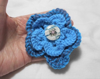 Hand knitted flower brooch / Corsage, Blue mix yarn, Pearly button centre, 10 cm