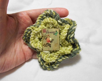 Hand knitted flower brooch / Corsage, Green mix Yarn, Wood button centre, 10 cm