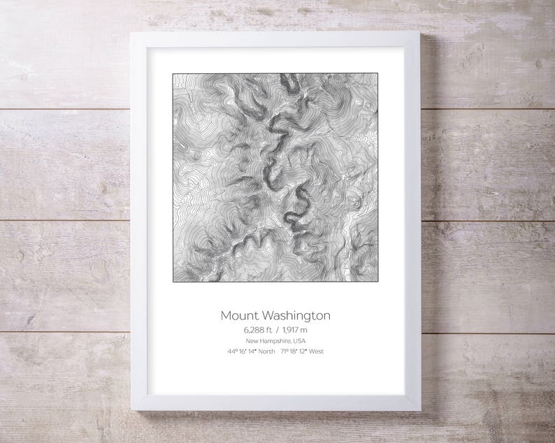 May include: A black and white topographic map print of Mount Washington in New Hampshire, USA. The print shows the mountain's elevation contours and includes the text "Mount Washington", "6,288 ft / 1,917 m", "New Hampshire, USA", "44 16 14 North 71 18 12 West".