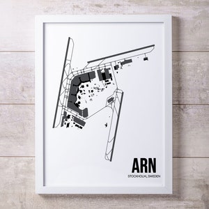 May include: A black and white airport map print with the text "ARN STOCKHOLM, SWEDEN".