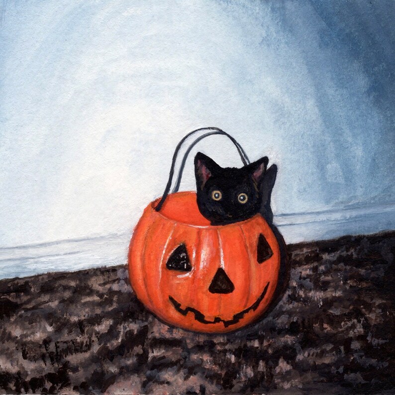 May include: A black kitten peeks out of an orange jack-o'-lantern. The pumpkin is sitting on a dark brown surface.