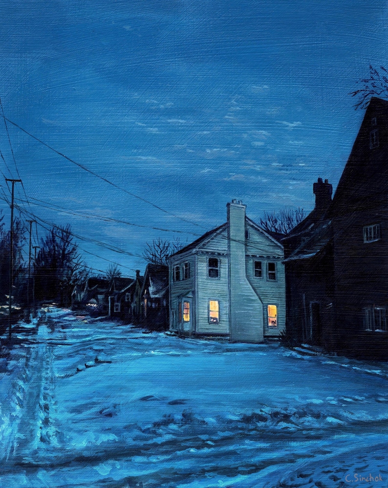 May include: An oil painting of a snow-covered street at night, lit by the warm glow of house lights. The houses are painted in shades of white and dark blue, with a deep blue sky above. The artist's signature is in the bottom right corner.