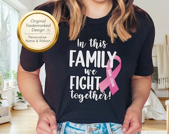 Maglietta contro il cancro, in questa famiglia combattiamo insieme, maglietta personalizzata contro il cancro al seno, nastro contro il cancro, lotta contro il cancro, regalo contro il cancro, supporto contro il cancro