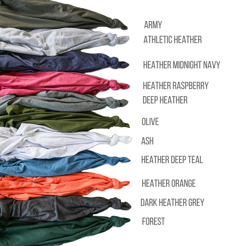 May include: A collection of folded t-shirts in various colors, including army green, athletic heather, heather midnight navy, heather raspberry, deep heather, olive, ash, heather deep teal, heather orange, dark heather grey, and forest.