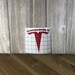 Tesla Emblem Logo Vinyl Decal - for laptops cars cups hydro flasks mugs windows fridge snowboard lunchbox toolbox 