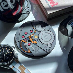 POSAVASOS CALIBRE H.45: Juego de 3 - Diseño de movimiento de reloj de silicona imagen 5