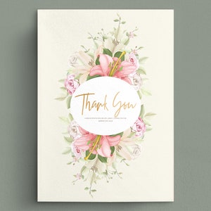 May include: A white card with a pink and white floral wreath surrounding a circle with the text "Thank You".