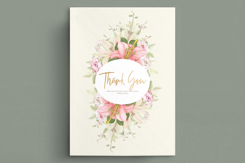 May include: A white card with a pink and white floral wreath surrounding a circle with the text "Thank You".