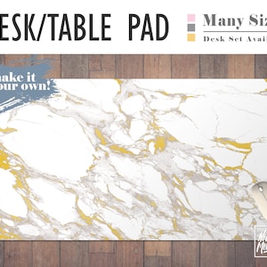 May include: White marble desk pad with gold veining. The pad has the text "make it your own!" in gray on the top left corner. The pad is on a wood surface. The text "Many Sizes" and "Desk Set Available" is in the top right corner.