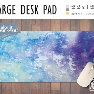 May include: A large desk pad with a watercolor design of blue and purple trees. The desk pad measures 22x12 inches. The text "make it your own!" is in the top left corner.