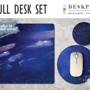 May include: Full desk set with a blue and white starry night design. The set includes a large desk pad, a round mousepad, and a round coaster. The text "make it your own!" is on the desk pad.