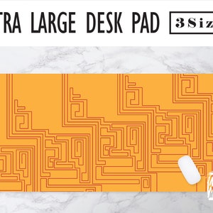 May include: A large orange desk pad with a geometric pattern of thin red lines. The text "3 Sizes" is in a black rectangle in the upper right corner.