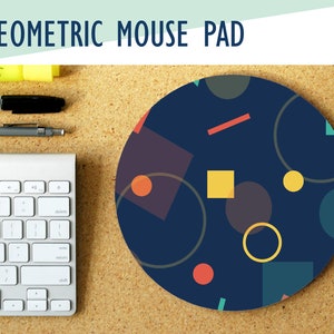 May include: A round blue mouse pad with a geometric pattern of circles, squares, and rectangles in various colors, including red, yellow, orange, and green.