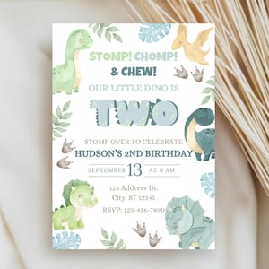 May include: A rectangular birthday invitation card featuring watercolor illustrations of green and blue dinosaurs, tropical leaves, and footprints. The text reads: STOMP! CHOMP! & CHEW! OUR LITTLE DINO IS TWO. HUDSON'S 2ND BIRTHDAY, SEPTEMBER 13 AT 9 AM.