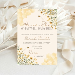 May include: A gender reveal invitation card featuring a cream background, yellow honeycomb patterns, and watercolor illustrations of yellow wildflowers and bees. The text reads: He or She WHAT WILL BABY BEE? JOIN US FOR A GENDER REVEAL IN HONOR OF Sarah Smith SATURDAY, SEPTEMBER 13TH AT 1PM 123 Address Dr. City, ST 12345 RSVP 123-456-7890.