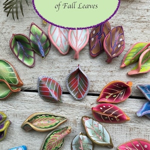 May include: A collection of colorful, handcrafted leaf-shaped objects. The leaves feature a variety of colors, including green, red, pink, and blue, with intricate designs. The text in the image reads "The Colors and Designs of Fall Leaves."