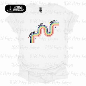 May include: White t-shirt with a rainbow design and the text "Progress is not linear" in black lettering.