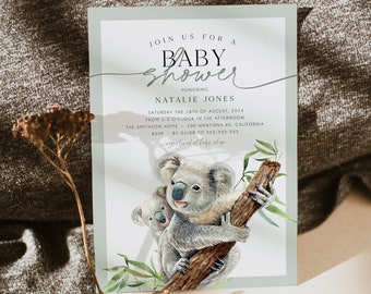 Könnte beinhalten: Eine hellblaue Babyparty-Einladung mit einer Aquarell-Illustration von zwei Koalas auf einem Baumzweig. Der Text lautet "Join us for a Baby Shower honoring Natalie Jones Saturday the 18th of August, 2024 from 1-3 o'clock in the afternoon The Smithson Home - 100 Wantirna Rd, California RSVP by 01/08 to 555-555-555 registered at the shop"