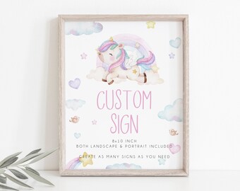 May include: A framed print featuring a whimsical unicorn illustration with a rainbow and clouds. The text "CUSTOM SIGN" is displayed in pink. The print is 8x10 inches and includes both landscape and portrait options.