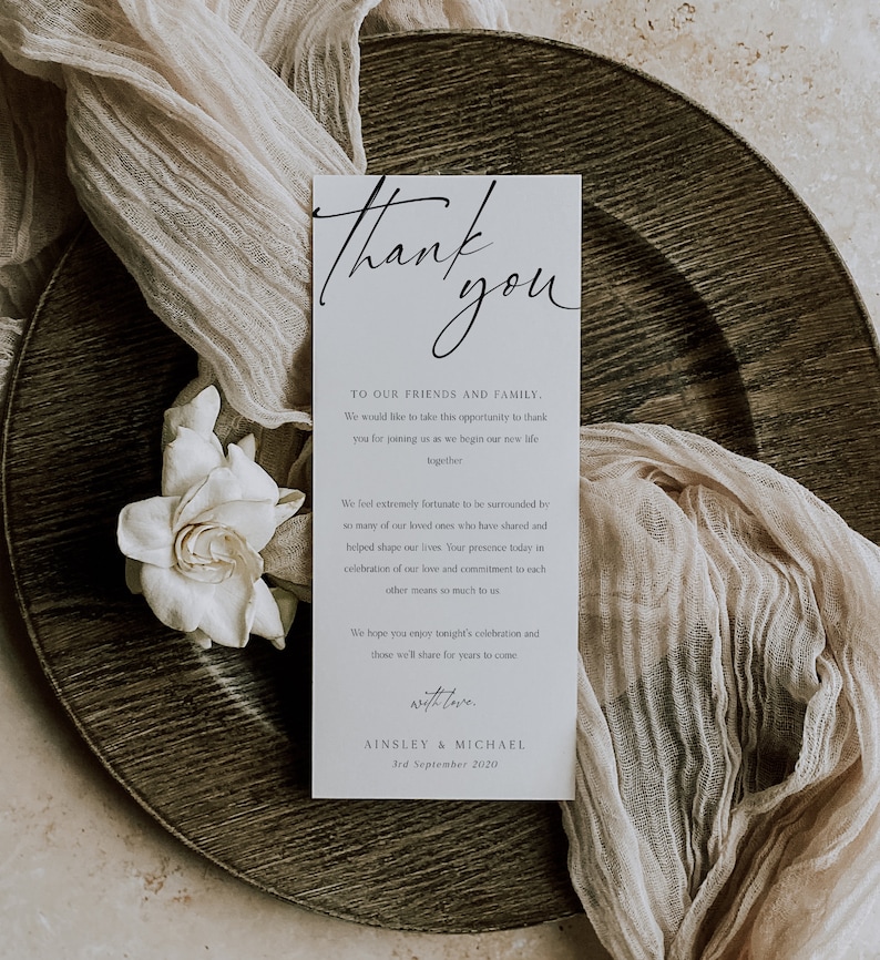 May include: A white thank you card with black calligraphy. The card reads "Thank you" in a large script font. The text below reads "To our friends and family. We would like to take this opportunity to thank you for joining us as we begin our new life together." The card also includes a message of gratitude for the guests' presence at the wedding and a date of September 3rd, 2020.
