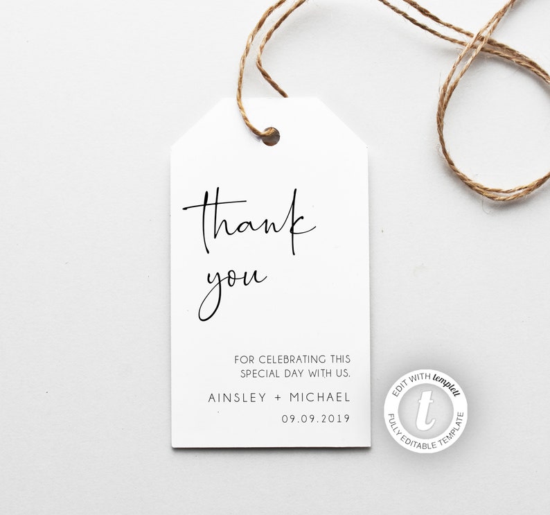 May include: White thank you tag with black calligraphy that reads "Thank you" and the text "FOR CELEBRATING THIS SPECIAL DAY WITH US. AINSLEY + MICHAEL 09.09.2019". The tag is tied with twine.