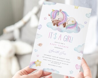 May include: A baby shower invitation with a watercolor illustration of a unicorn sleeping on a cloud. The invitation is decorated with stars, hearts, and birds. The text on the invitation reads "It's a Girl!" and includes the date, time, and location of the shower.
