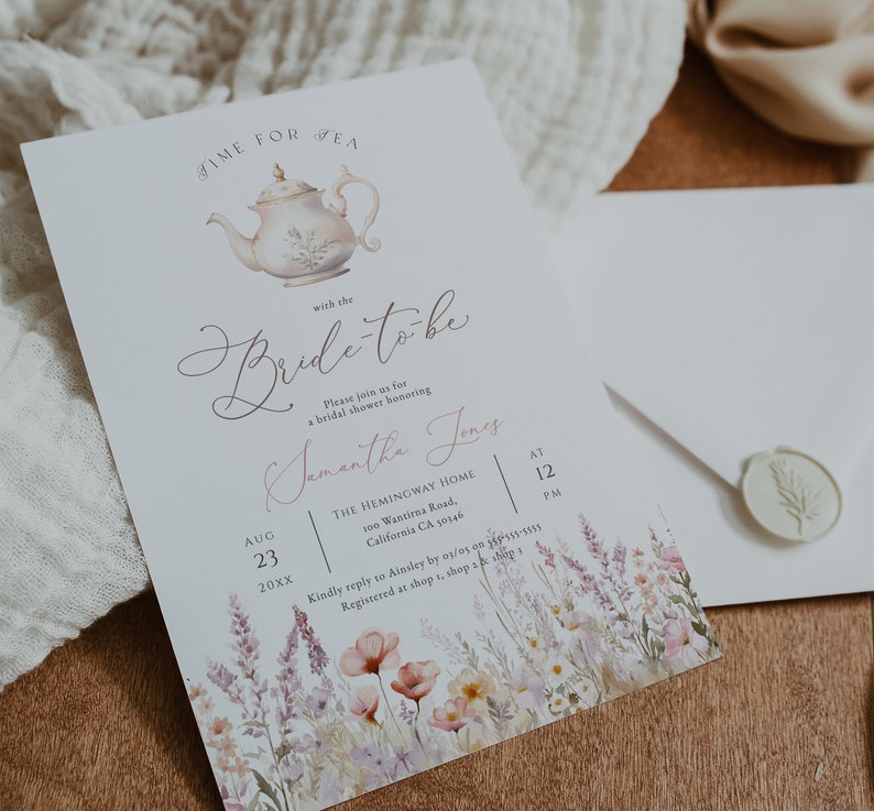 May include: A white tea party invitation with a watercolor illustration of a teapot and floral accents. The invitation reads "Time for Tea with the Bride-to-be Samantha Jones" and includes the date, time, and location of the event.