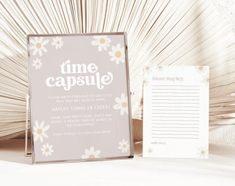 May include: A light purple card with white daisies and the text "time capsule" in a retro font. The card instructs guests to write a message for a baby boy to be read when he turns 18. A white card with a lined area for writing and the text "Dear Hayley" and "with love" is also shown.