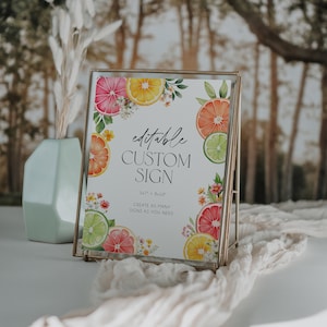 May include: Editable custom sign with a citrus fruit theme. The sign is 5x7 inches and 8x10 inches. The sign features a watercolor illustration of lemons, limes, and grapefruits with flowers. The text on the sign reads "editable custom sign 5x7" + 8x10" create as many signs as you need".