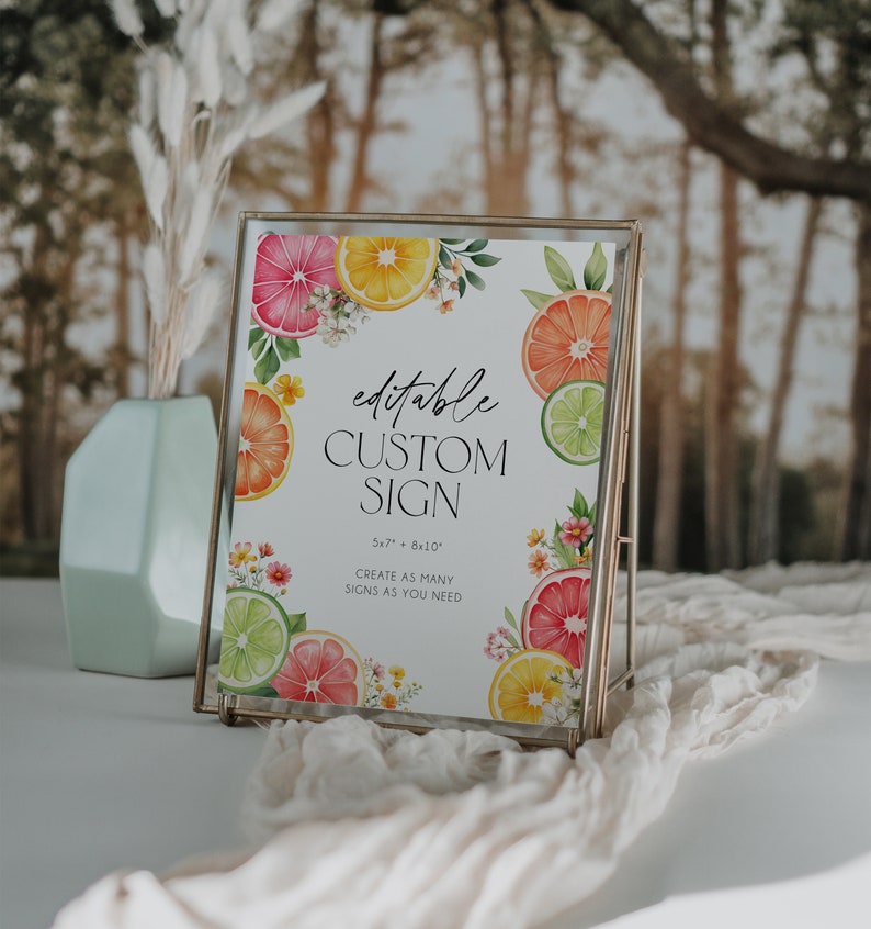 May include: Editable custom sign with a citrus fruit theme. The sign is 5x7 inches and 8x10 inches. The sign features a watercolor illustration of lemons, limes, and grapefruits with flowers. The text on the sign reads "editable custom sign 5x7" + 8x10" create as many signs as you need".