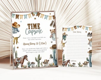 May include: A printable time capsule sign with a western theme. The sign says "Time Capsule" and includes the text "Please write a message to our little one, that will be read when Henry turns 18 (20xx)". The sign is decorated with cacti, stars, cowboy hats, and a teddy bear wearing a cowboy outfit.