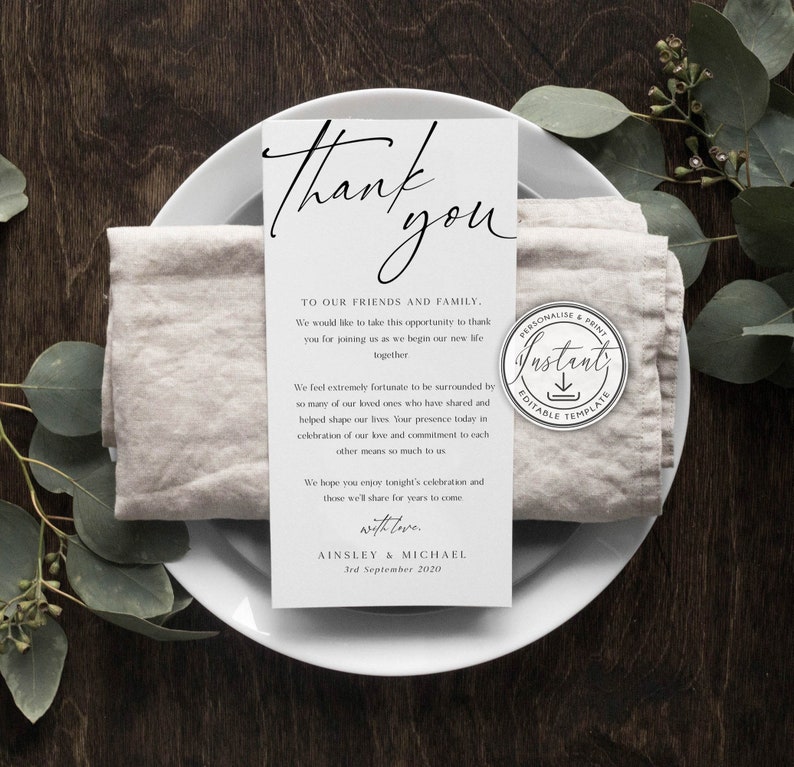 May include: A white thank you card with black text. The card reads "Thank you" in a script font. The text continues with a message to friends and family, expressing gratitude for their presence at the wedding. The card is signed "Ainsley & Michael" and includes the date "3rd September 2020".