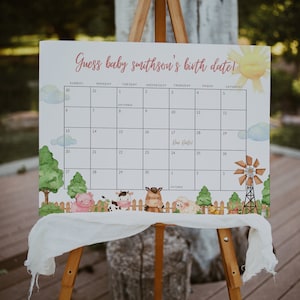 May include: A white calendar with a farm theme. The calendar is set up to guess a baby's birth date. The due date is marked on September 17th. The calendar has a watercolor background with farm animals and a windmill.