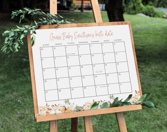 Op de afbeelding: Een witte kalender met zwarte rasterlijnen en de tekst "Guess Baby Smithsong's birth date" in bruin handschrift. De kalender is ingesteld voor september en oktober, met de vervaldatum gemarkeerd op 17 september.