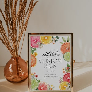 May include: Editable custom sign with a citrus fruit theme. The sign is 5.7" x 8.10" and features a watercolor illustration of lemons, limes, grapefruits, and flowers. The text on the sign reads "editable custom sign 5.7" x 8.10" create as many signs as you need".