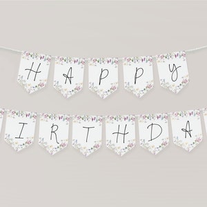 Pode incluir: Uma faixa branca com um padr&atilde;o floral e as palavras "Happy Birthday" escritas em preto.
