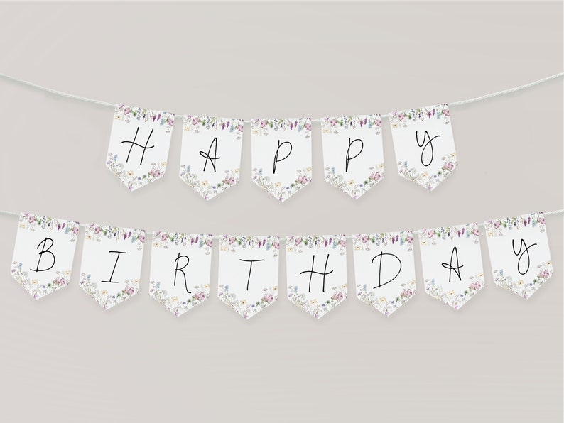Pode incluir: Uma faixa branca com um padr&atilde;o floral e as palavras "Happy Birthday" escritas em preto.