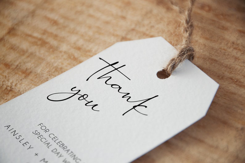 May include: White thank you tag with a handwritten thank you message. The tag is tied with twine and has a hole punched in the top.