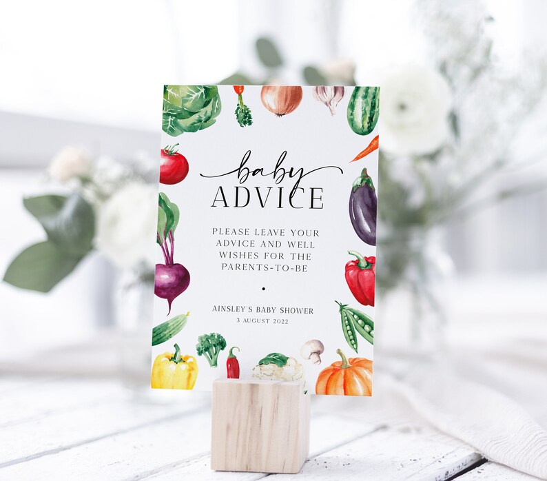 May include: A white card with a watercolor illustration of vegetables and the text "baby advice" in black script. The card also includes the text "Please leave your advice and well wishes for the parents-to-be" and "Ainsley's Baby Shower 3 August 2022".