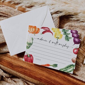 May include: A white card with a colorful vegetable border. The card has lines for writing advice and well wishes. The text "advice & well wishes" is written in black cursive. The card also has the word "LOVE." written in black cursive.
