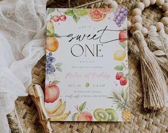 May include: A colorful invitation with a watercolor illustration of fruit and the text "She's a sweet one" and "Malias 1st Birthday". The invitation includes the date, time, address, and RSVP information.