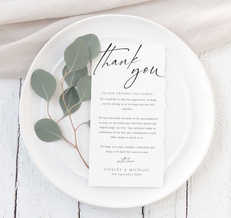 May include: A white thank you card with a handwritten message expressing gratitude to friends and family for attending a wedding. The card includes the couple's names, Ainsley & Michael, and the wedding date, 3rd September 2020.