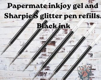 May include: Six black ink pen refills for Papermate InkJoy gel and Sharpie S-Gel pens. Each refill features a clear plastic tube containing black ink, a metal tip, and a white plastic end cap. The text reads: Papermate inkjoy gel and Sharpie S glitter pen refills. Black ink.