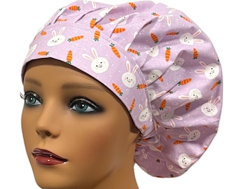 May include: A purple scrub hat with a white bunny and orange carrot pattern. The hat is made of soft, comfortable fabric and is perfect for nurses, doctors, and other healthcare professionals.